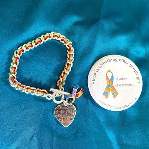 Autism awareness bracelet and pin.